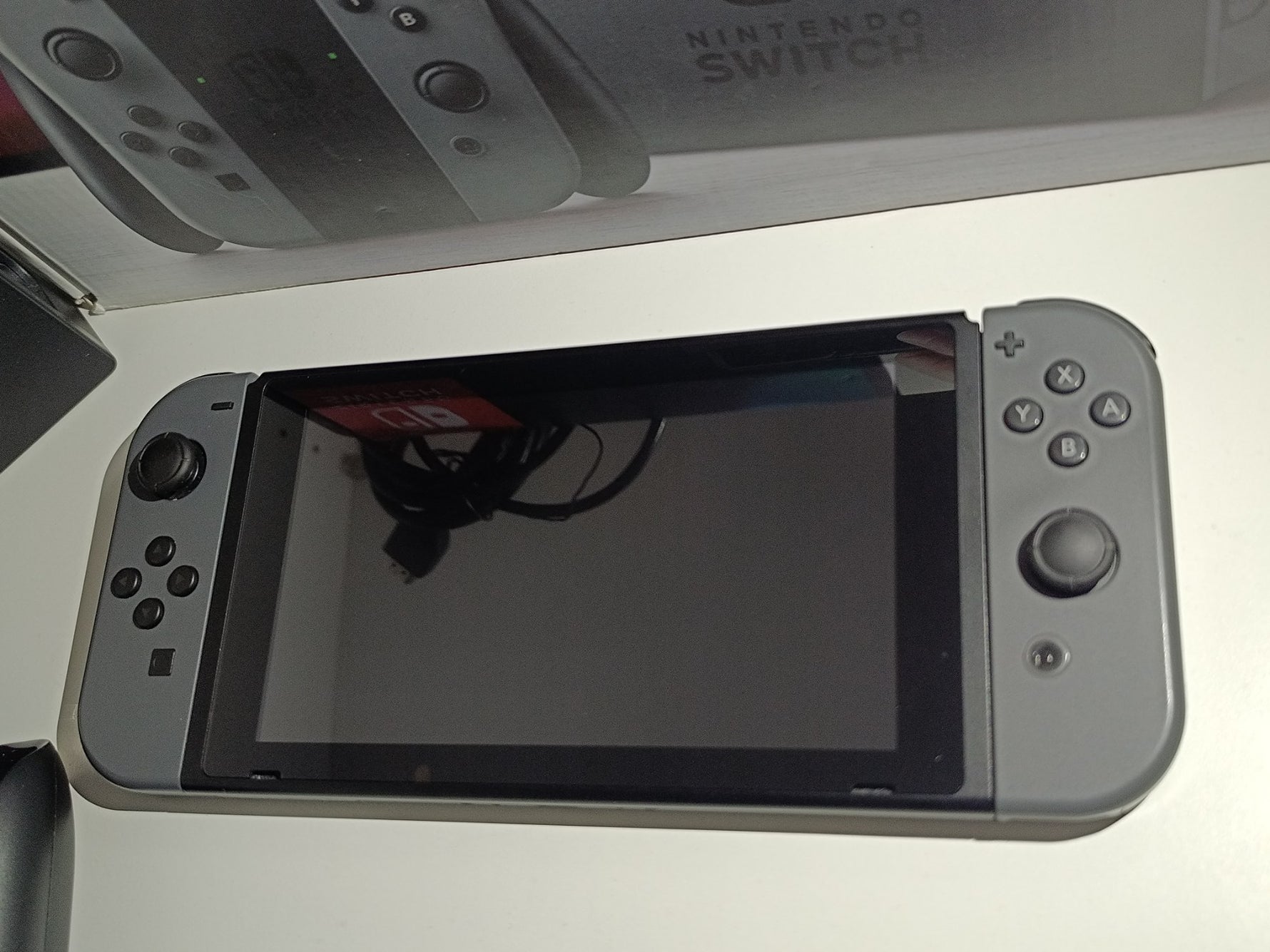 Nintendo Switch console on a white surface